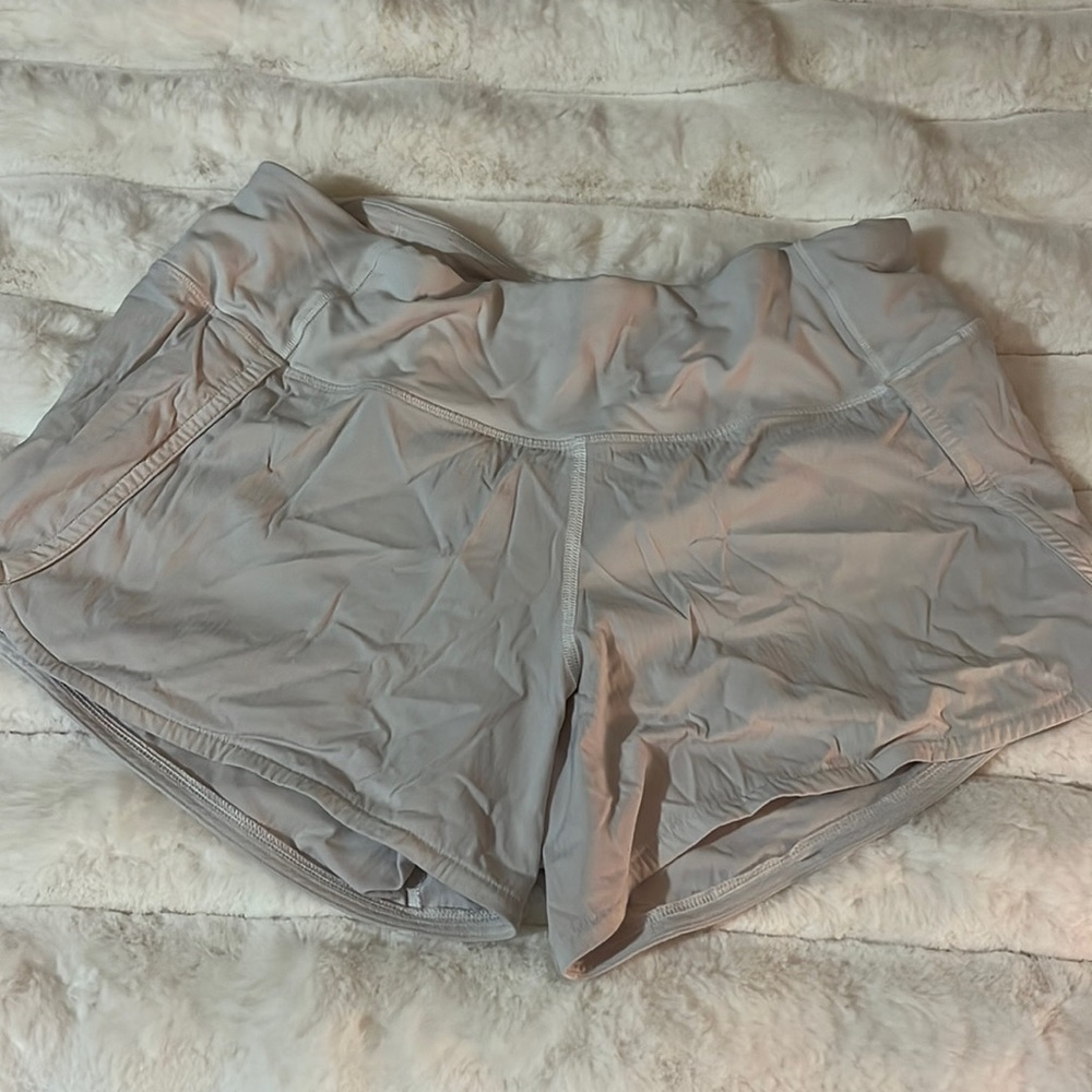 White Lululemon running shorts with back zip pocket